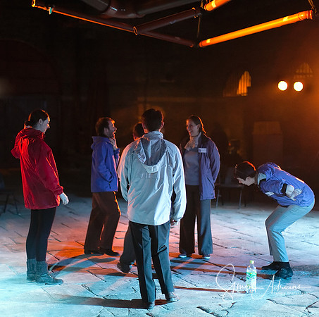 The cast warming up